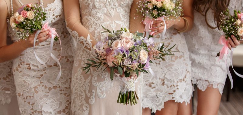 Wedding flowers, bride and bridesmaids holding their bouquets at