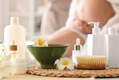 Cosmetic products and spa supplies on table in beauty salon