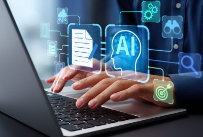 AI agent analyzing data and generating reports. Artificial intelligence and intelligent automation IA technology. Businessman using laptop computer to give instructions to AI at desk in office.