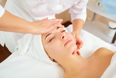 Beautiful woman at a facial massage at a spa salon.