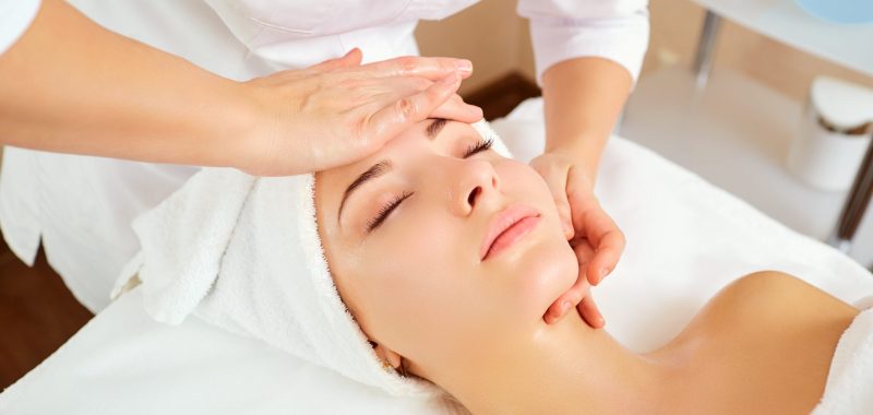 Beautiful woman at a facial massage at a spa salon.