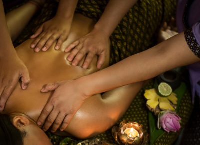 traditional asian thai four hand massage  in tropical spa detail