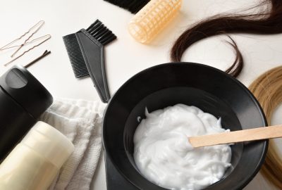 Hair coloring and care products on white table elevated view