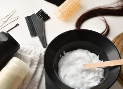 Hair coloring and care products on white table elevated view